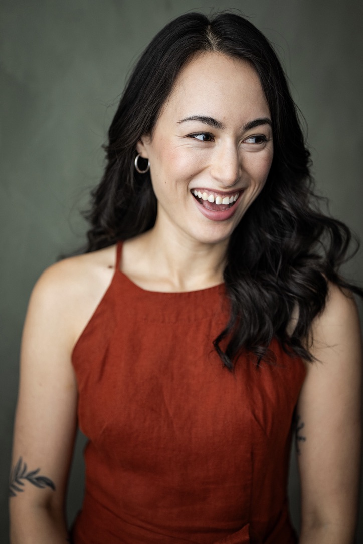 Sarah Suzuki smiling in a red top